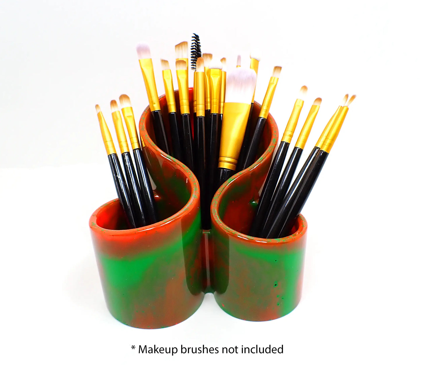 Photo showing how the handmade neon makeup brush holder holds makeup brushes. At the bottom of the photo it says "Makeup brushes not included."