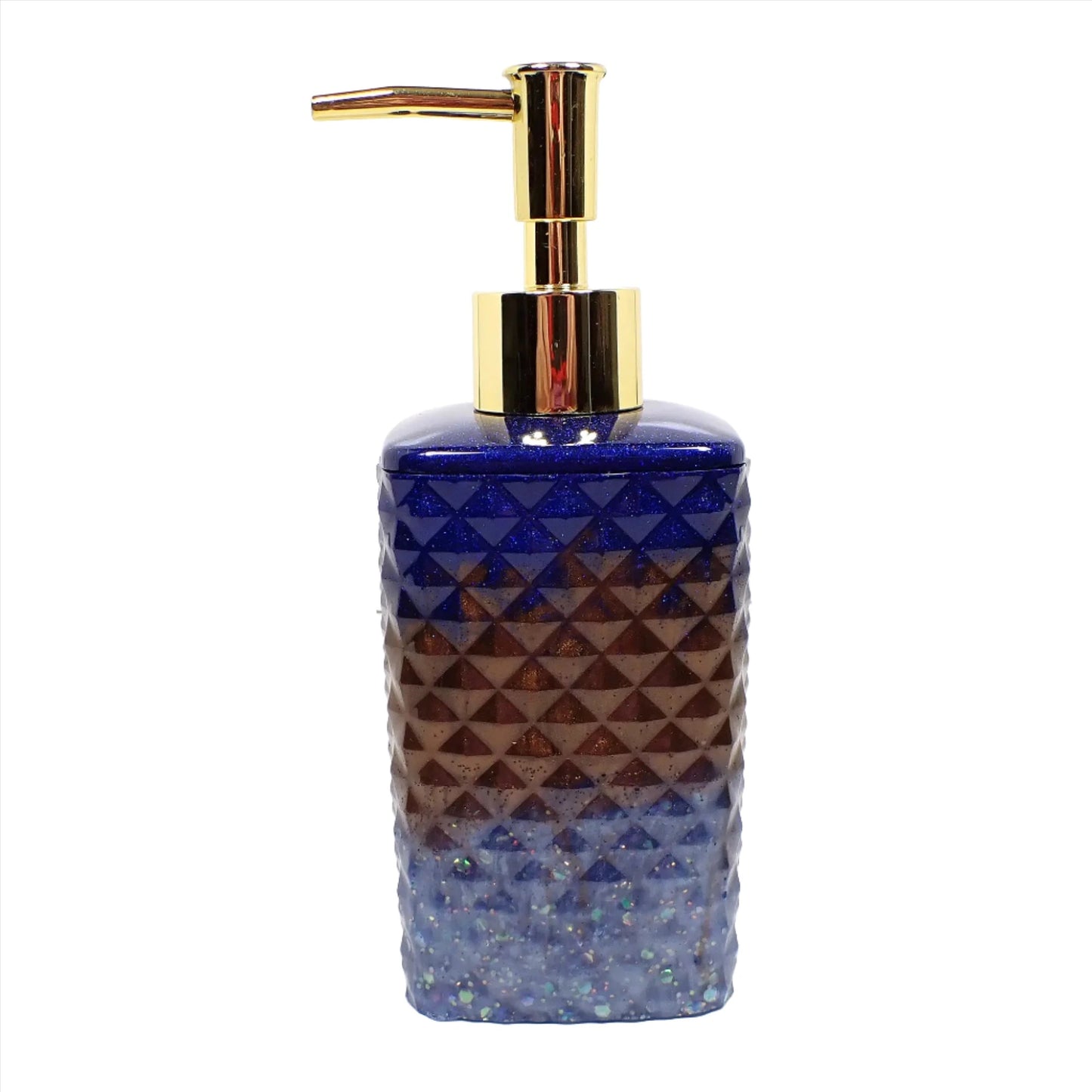 Side view of the handmade resin soap dispenser. It has a tall faceted square shape and has a gold color pump on top in this photo. The top part of the dispenser is dark blue with tiny blue glitter, the middle is dark brown, and the bottom is light blue with chunky iridescent glitter.