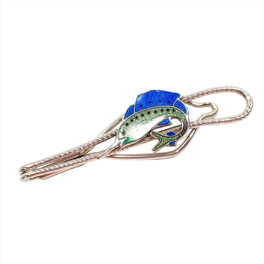 Front view of the Mid Century vintage slide on tie bar. The metal is silver tone in color and has a textured open loop style design. The front has a blue, green, and white enameled sailfish with curved tail.