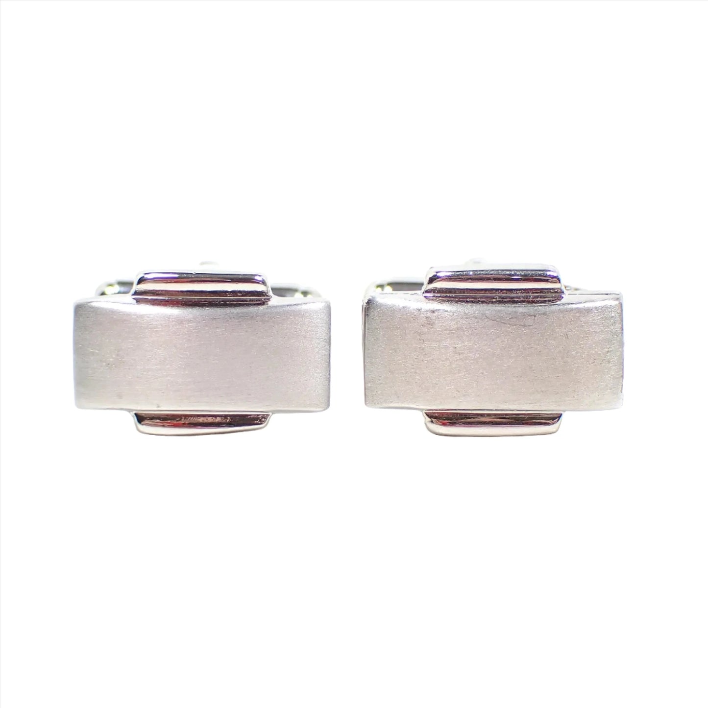 Front view of the retro vintage Modernist style cufflinks. The metal is silver tone in color. There are long rectangles that have a matte metal appearance with a shiny metal bar area on the top and bottom middle. 