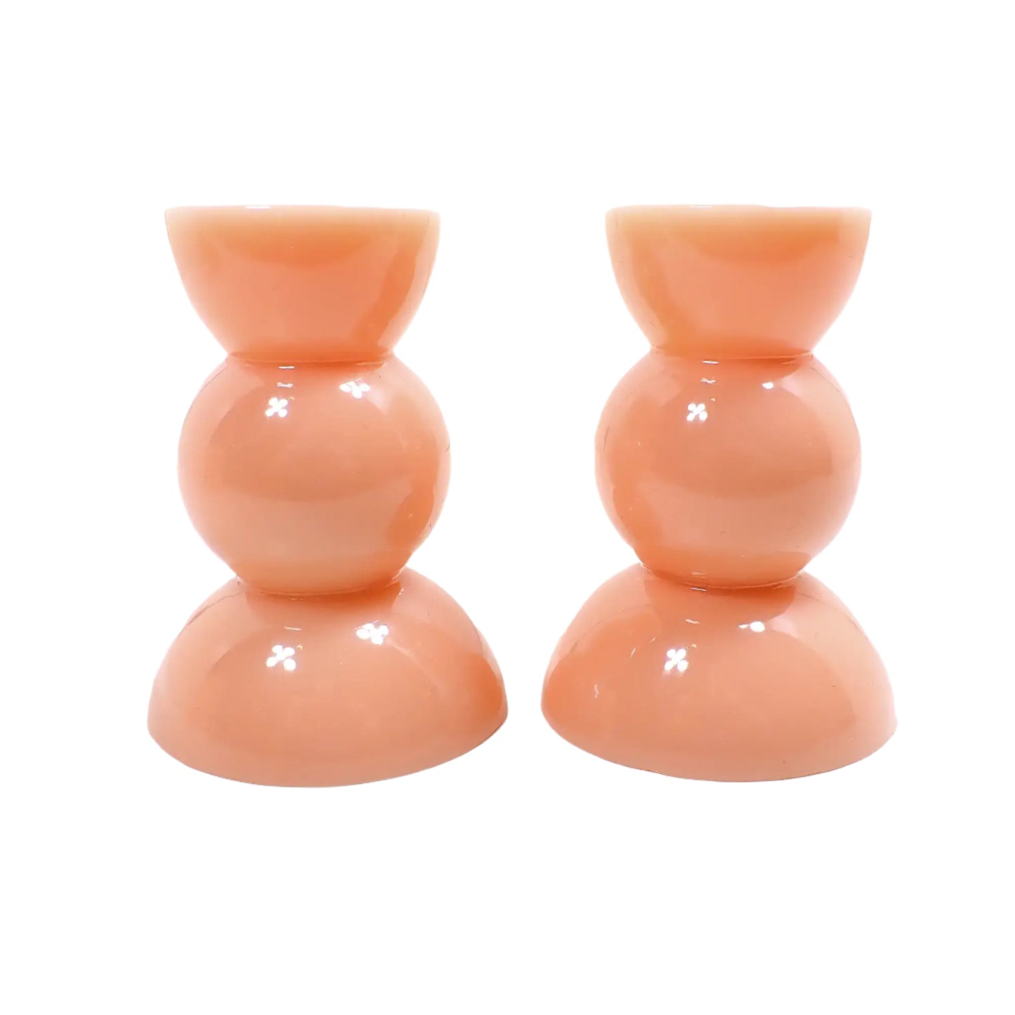 Side view of the candle holders. There is a half sphere shape at the top and bottom and a round sphere shape in the middle for a geometric appearance.