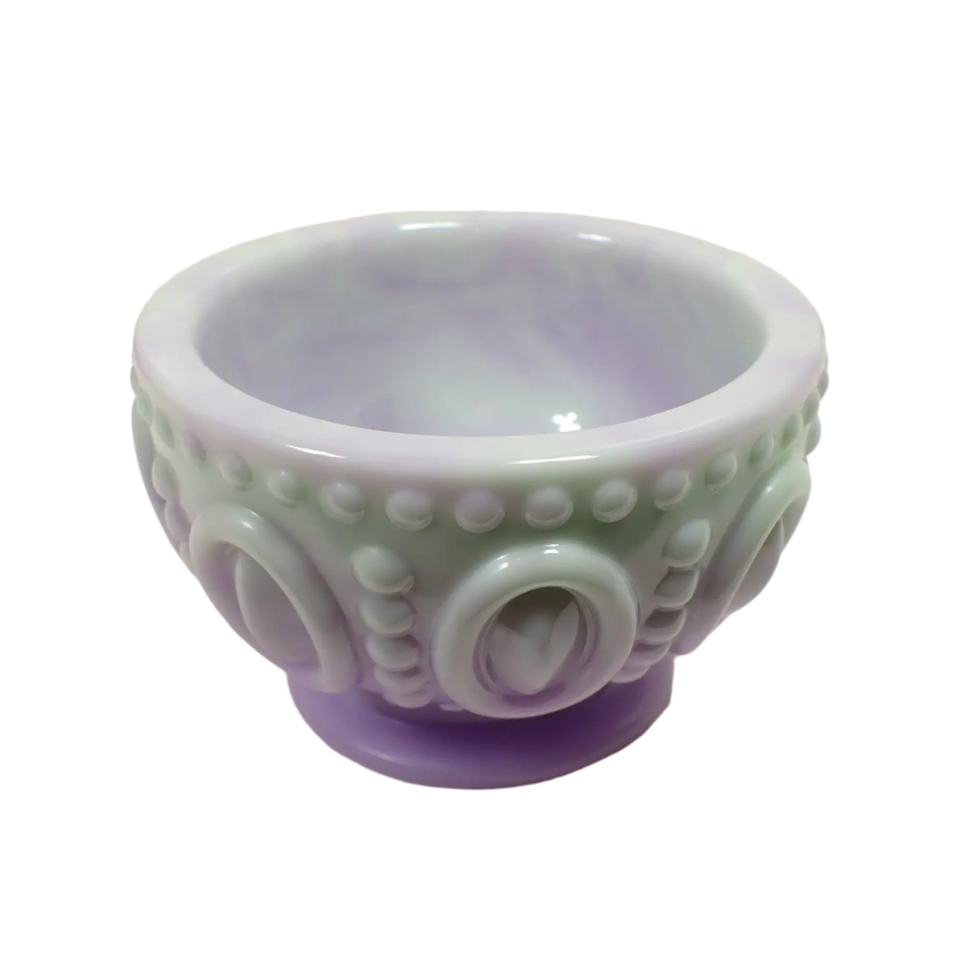 Angled side view of the handmade resin footed bowl. It has a smooth rounded edge at the top.