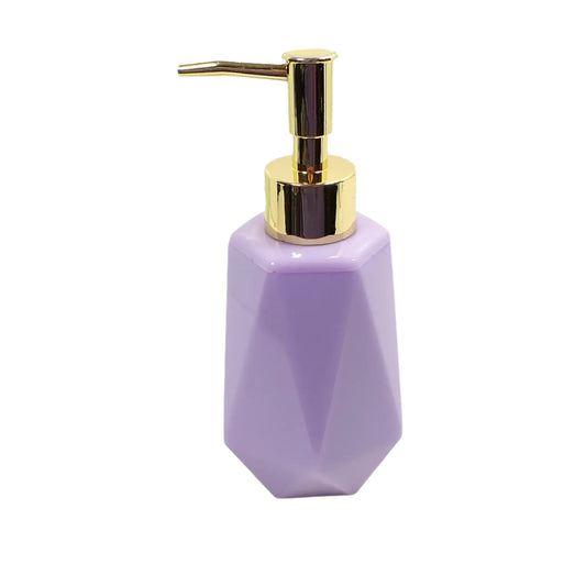 Angled view of the handmade resin soap dispenser. It has a faceted shape with flared bottom. The resin is light purple in color and there is a metallic gold color plastic pump on top in the photo.