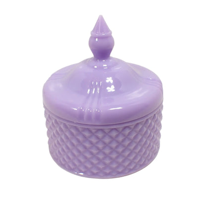 Angled side view of the handmade trinket box. The resin is a light pastel purple in color and is opaque.