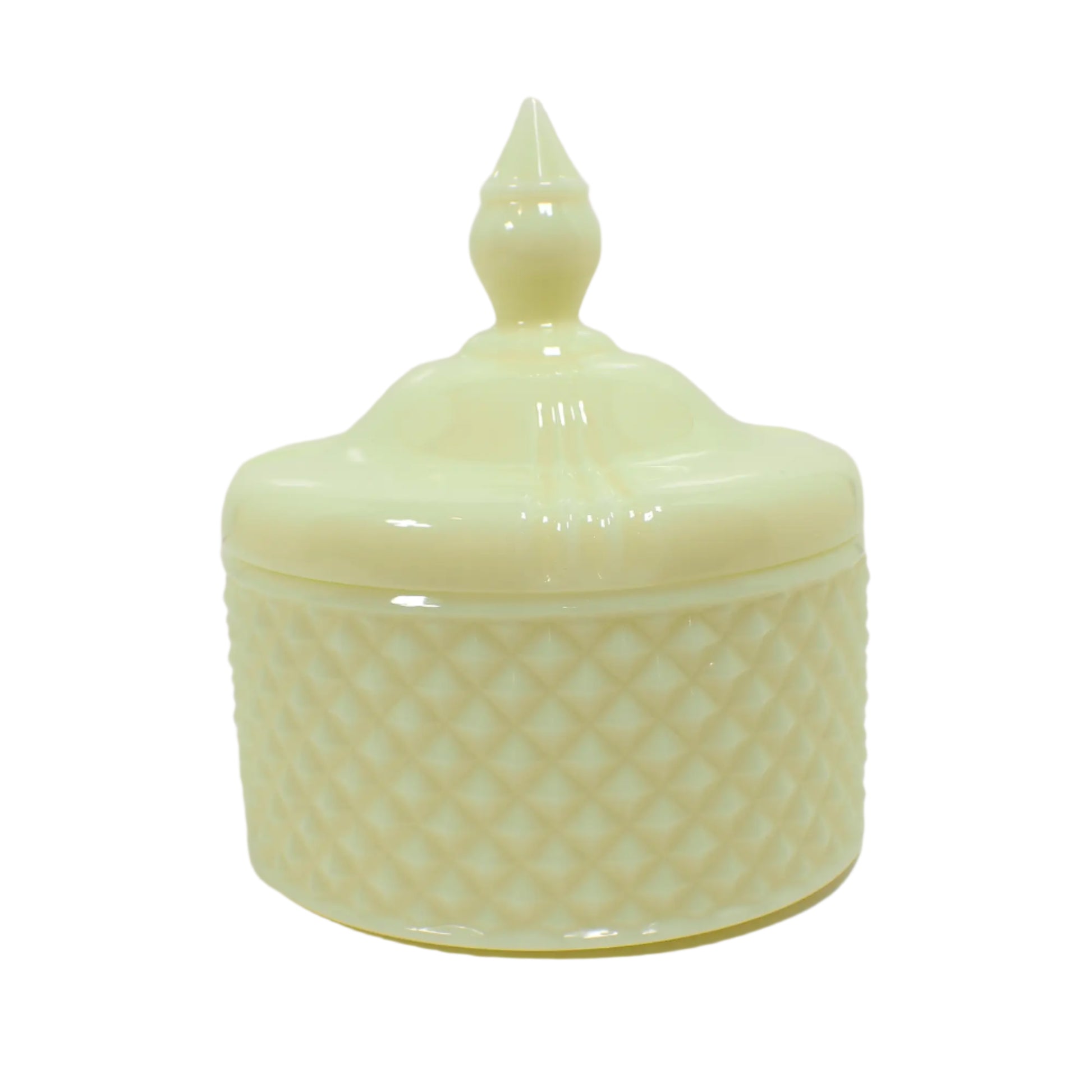 Side view of the handmade trinket box. The resin is a light pastel lemon cream yellow color. The top has a tapered knob to lift the lid and the bottom is round with a textured diamond shape pattern all the way around it.