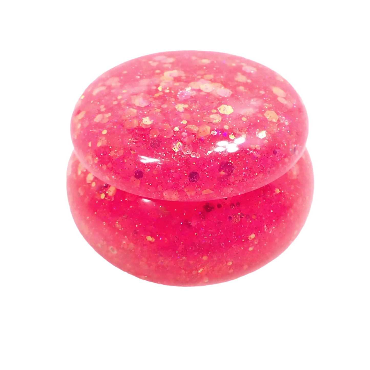 Side view of the handmade resin small round trinket box. It has chunky iridescent pink glitter all throughout.