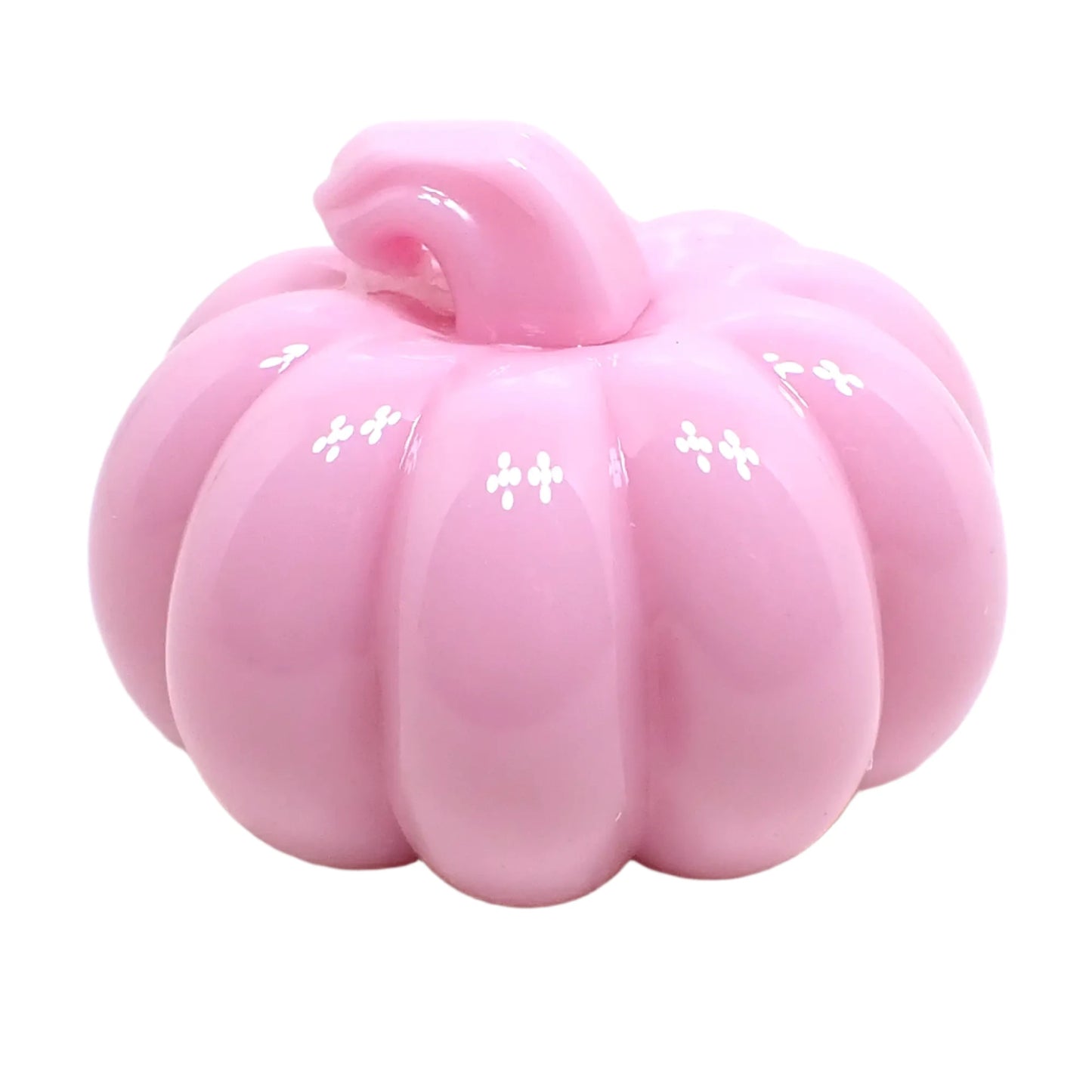 Side view of the small pumpkin showing how shiny the pastel pink resin is.