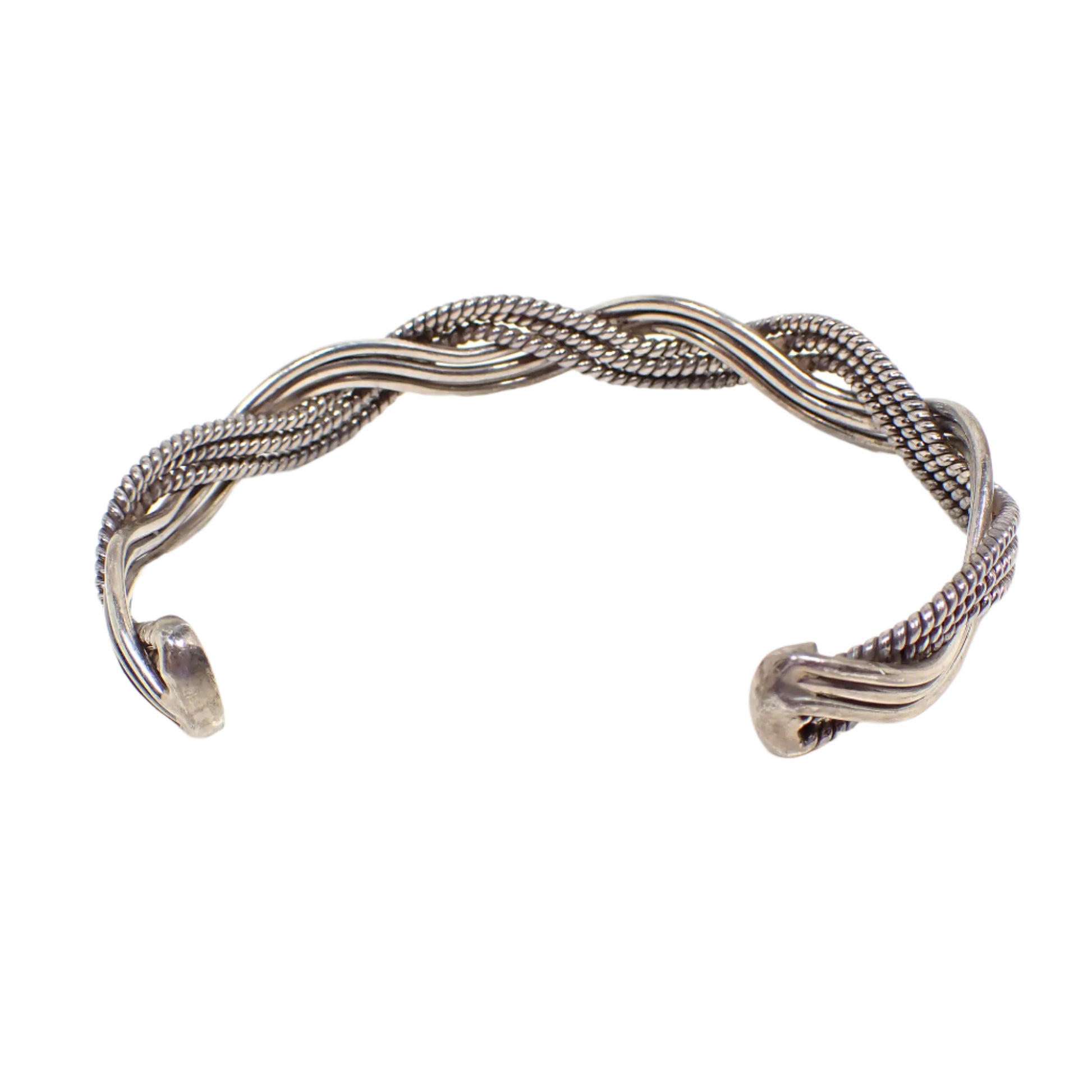 Back of the vintage sterling silver cuff bracelet. The inside of the bracelet looks like the front with smooth and textured braided curvy wires.