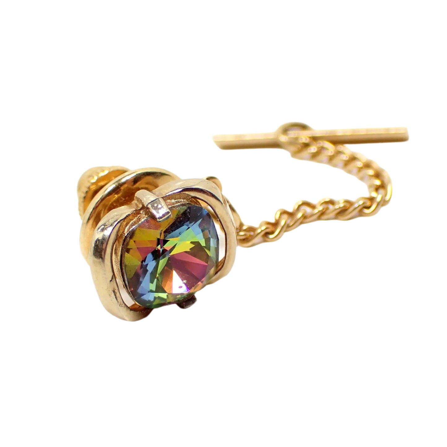 Angled view of the Swank vintage tie tack showing the many facets and colors sparkling from the rhinestone.