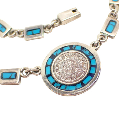 Close up of the pendant showing the Mayan Calendar design.