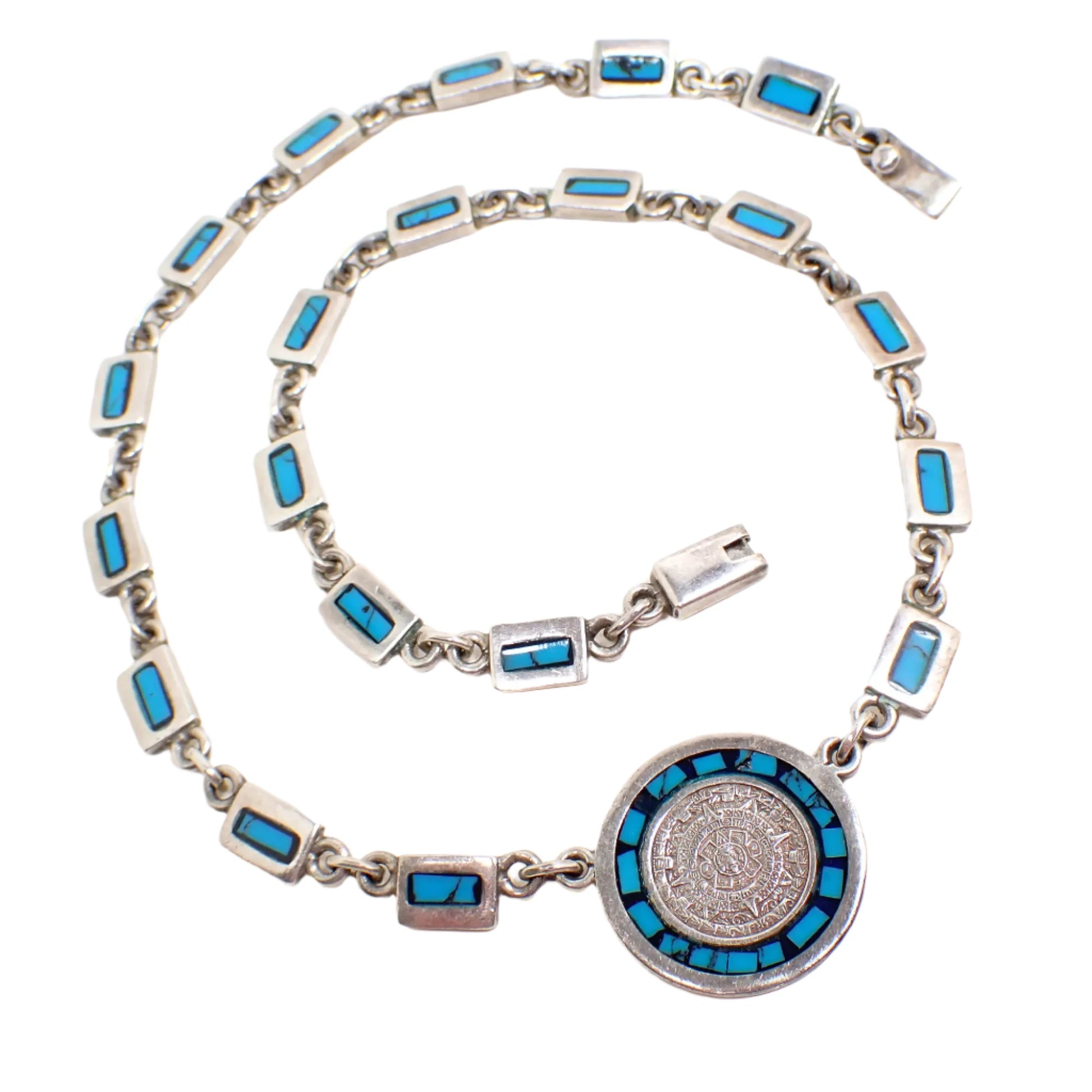 Another view of the entire necklace showing all the links, pendant, and clasp.