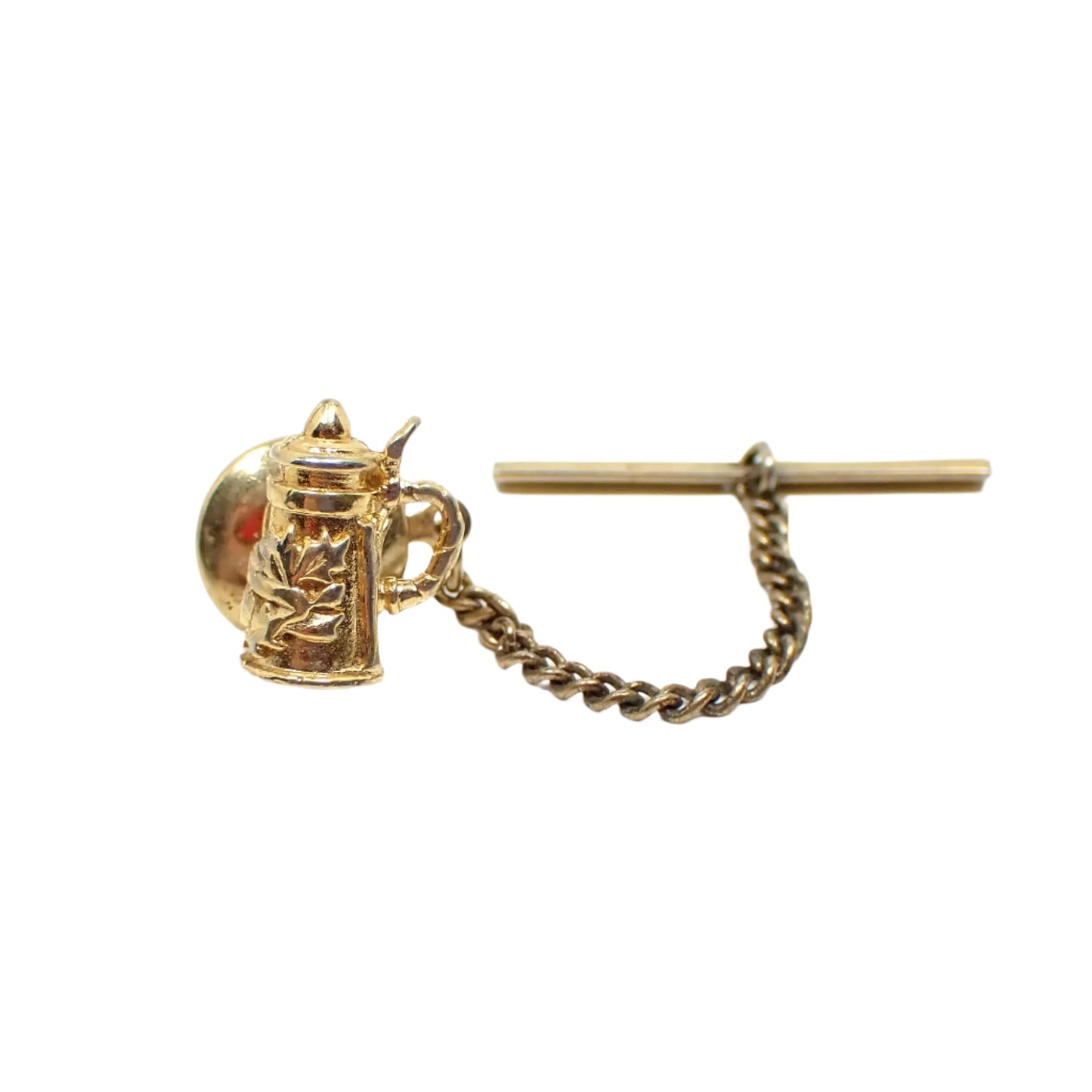 Another full view of the vintage stein tie tack. The gold plating is shiny and reflections from items in the room when taking the photo can be seen.