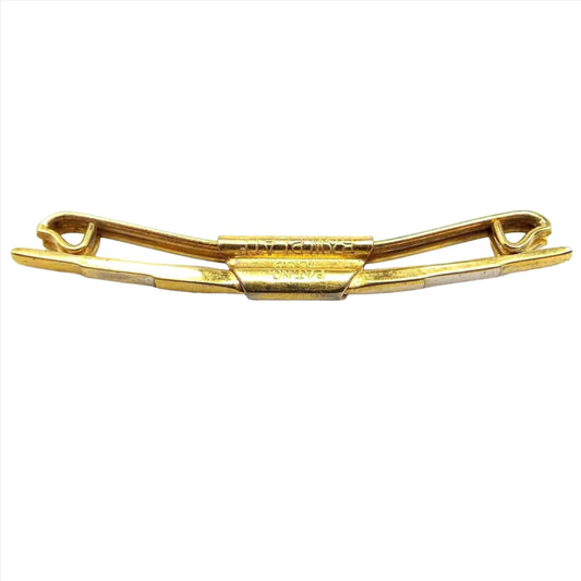 Front and side view of the 1920's Art Deco vintage Swank collar clip bar. The metal is gold tone in color. The front bar has a step like design on the front where each area is raised more until you get to the middle. The back bar has ends that are curled inwards. Stamped on the side is Pat. No 75818 B&W plate.