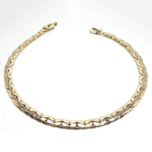 Top view of teh retro vintage chain necklace. The metal is gold tone in color. It has a flattery style C link chain design with a snap lock clasp on the end.