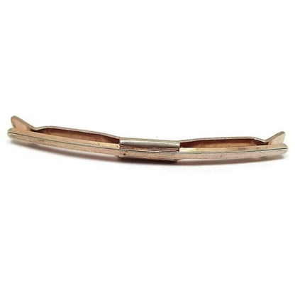 Front view of the Mid Century vintage Hayward collar bar clip. It is gold tone in color and has a basic design of a curved front bar with squared off ends. The back bar is curved with angled ends. Both sides are held together with a middle rectangle piece.
