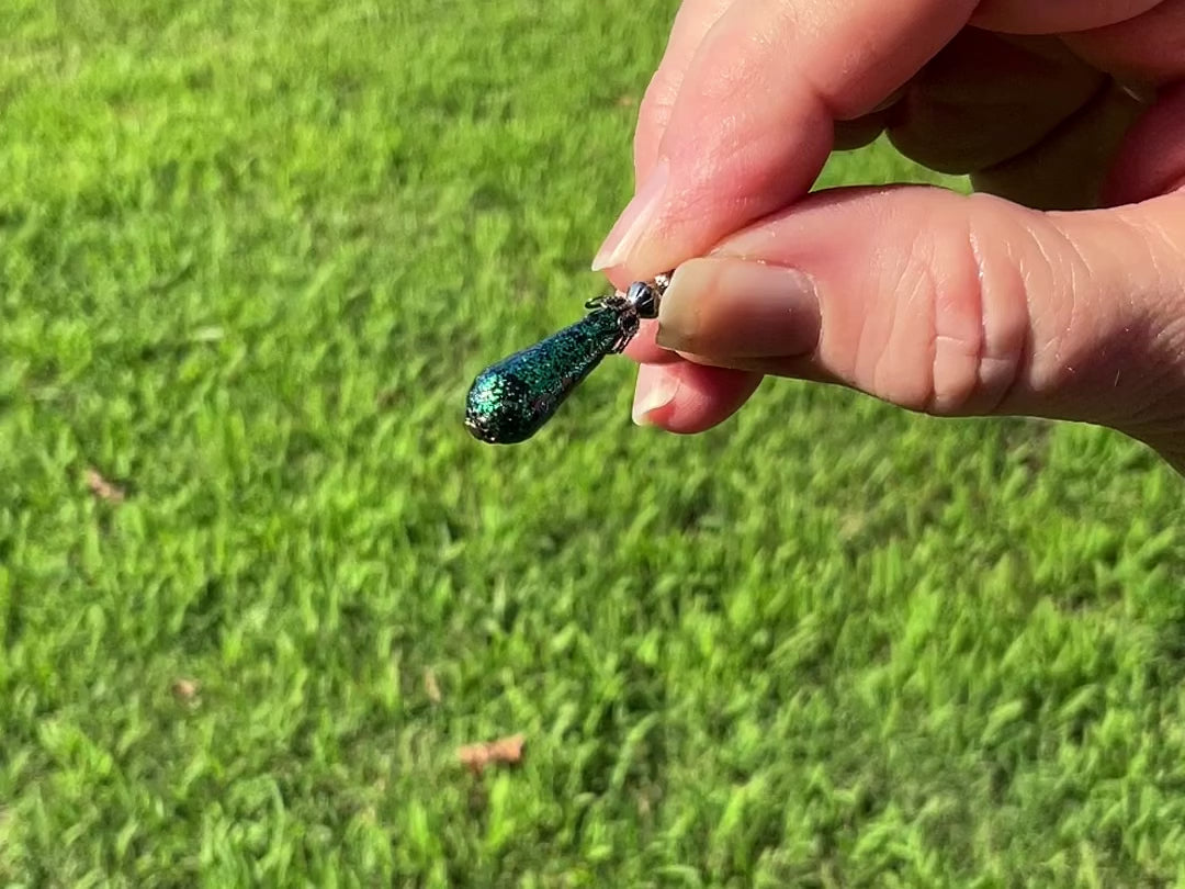 Gunmetal Plated Small Handmade Green Glitter Teardrop Earrings video showing how the glitter sparkles.