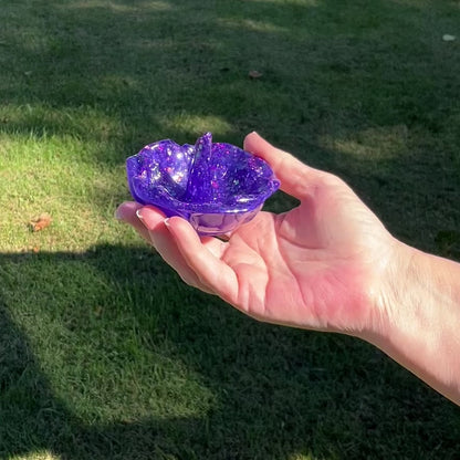 Pearly Blue Handmade Resin Flower Ring Dish Holder with Pink and Purple Iridescent Chunky Glitter video showing all the sparkle and glitz when the light hits the glitter.