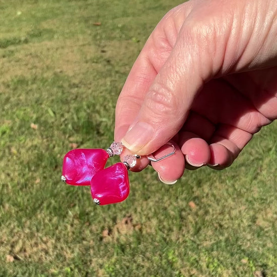 Handmade Color Shift Bright Pink Lucite Earrings video showing how the color goes from pink to purple in the light.