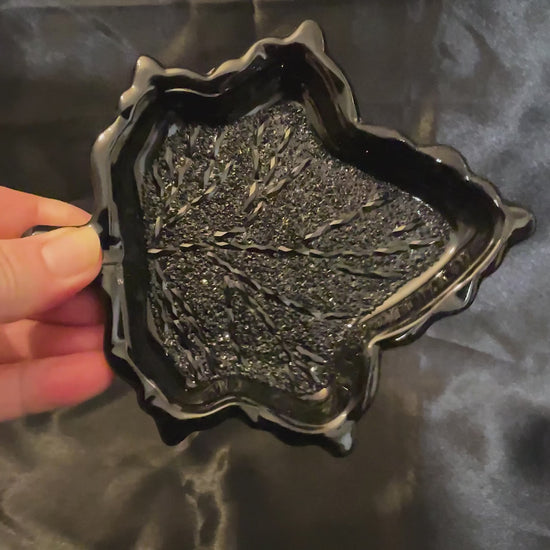 Video of the handmade resin Goth black leaf trinket dish showing how the inside crystal like area sparkles as it moves around in the light.