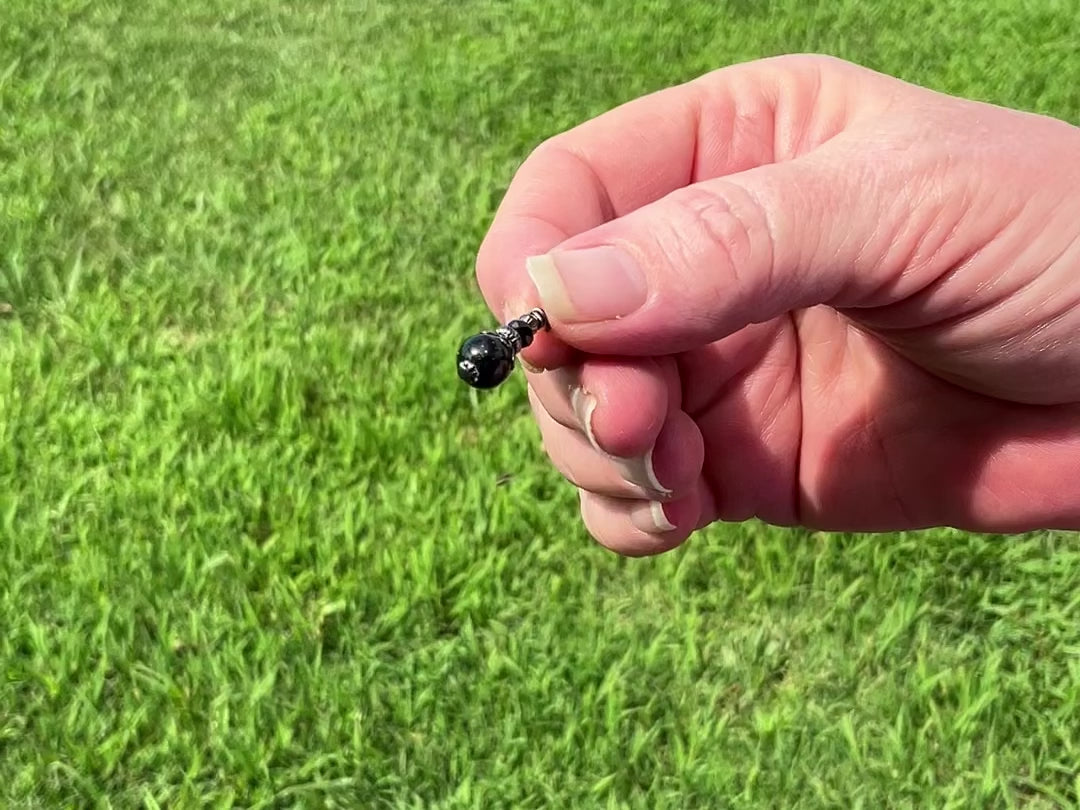 Gunmetal Plated Small Handmade Green Goldstone Drop Earrings video showing how the glitter sparkles in the light.