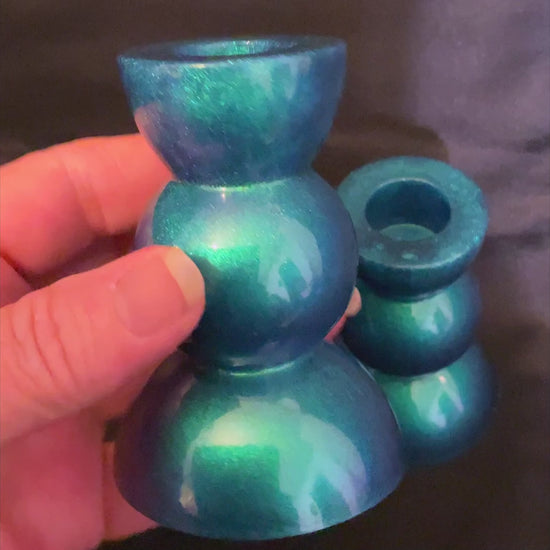 Handmade Pearly Color Shift Blue Green Resin Rounded Geometric Candlestick Holders video showing how the color shifts from blue to green in the light.