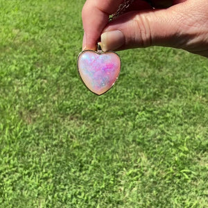 Handmade Pink Purple Blue Resin Bubble Heart Pendant Necklace video showing how the sheen of colors shows when moving around in the light.