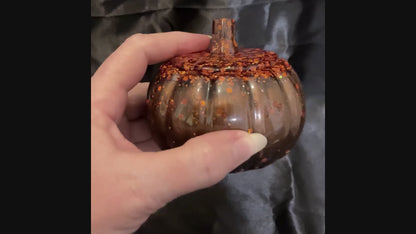 Video of the handmade pumpkin trinket box showing how the iridescent orange glitter sparkles against the pearly dark brown resin.