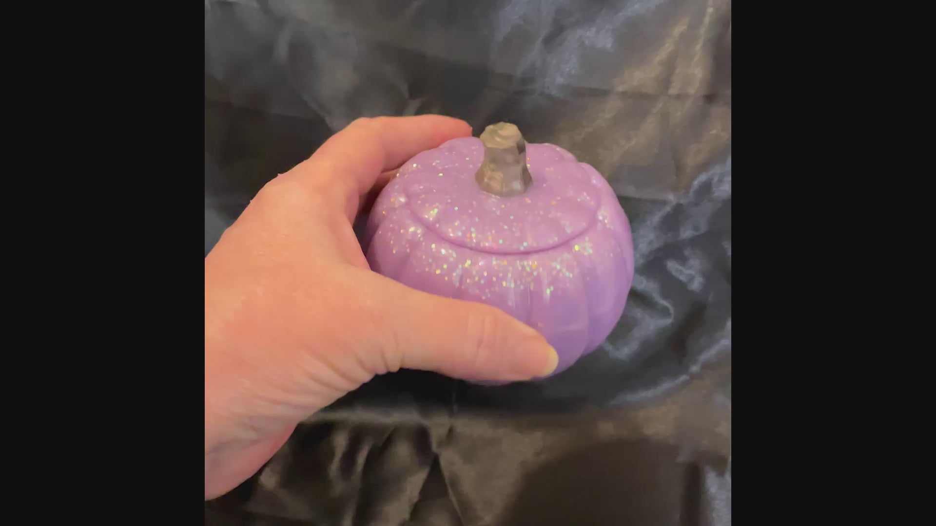 Video of the light purple pumpkin trinket box showing how the iridescent pastel glitter sparkles as the light hits it.