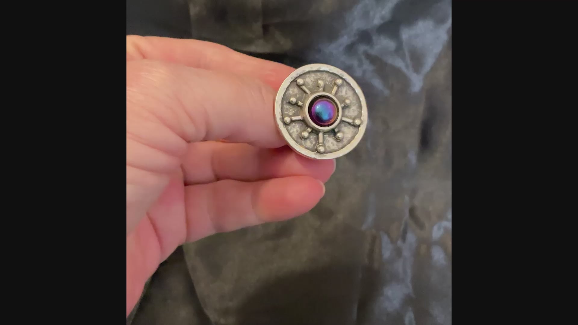 Video of the color shift starburst ring showing how the colors change depending on how the light is hitting it.