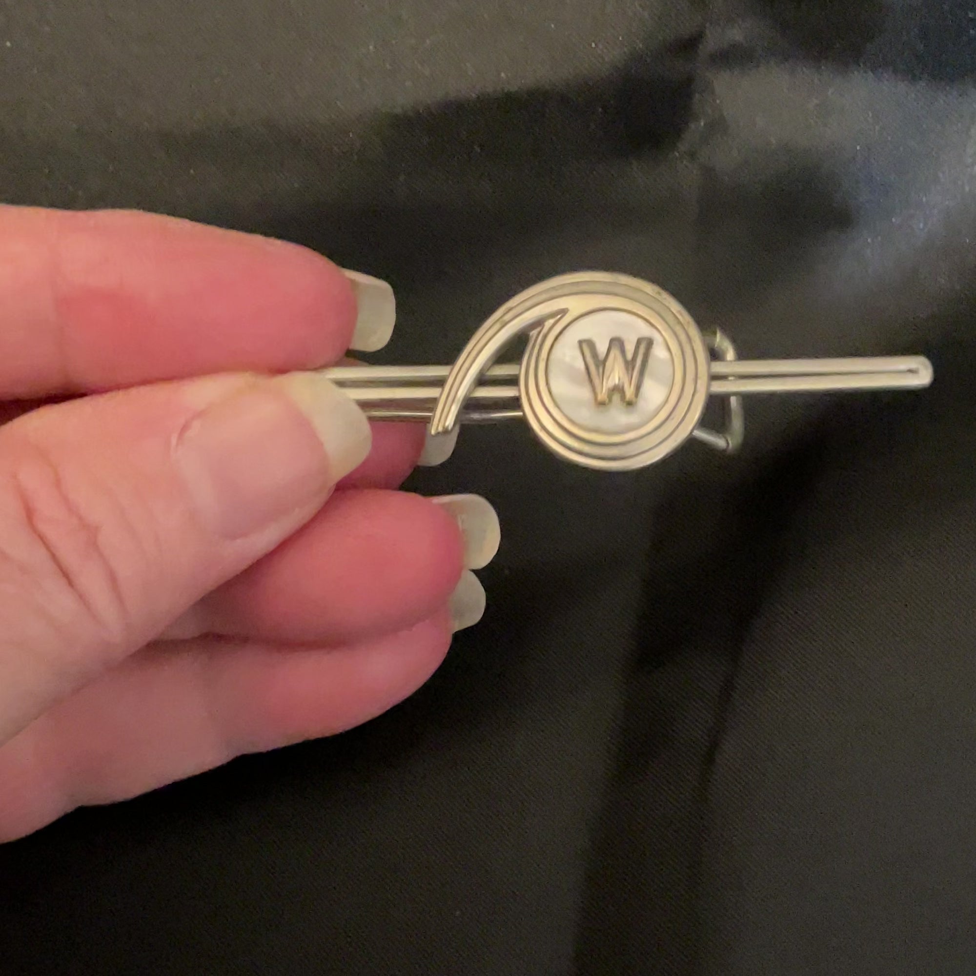 Video of Initial Letter W 1930's Art Deco Vintage Tie Bar with mother of pearl to show how the shell cab flashes pearly white in the light.