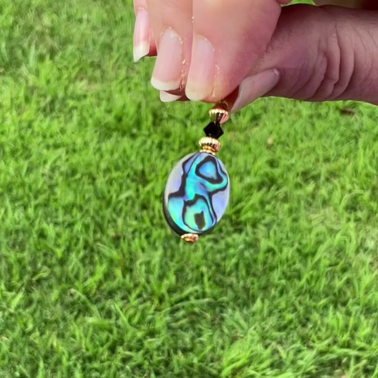 Gold Plated Abalone Handmade Oval Drop Earrings video showing how the colors flash in the light.