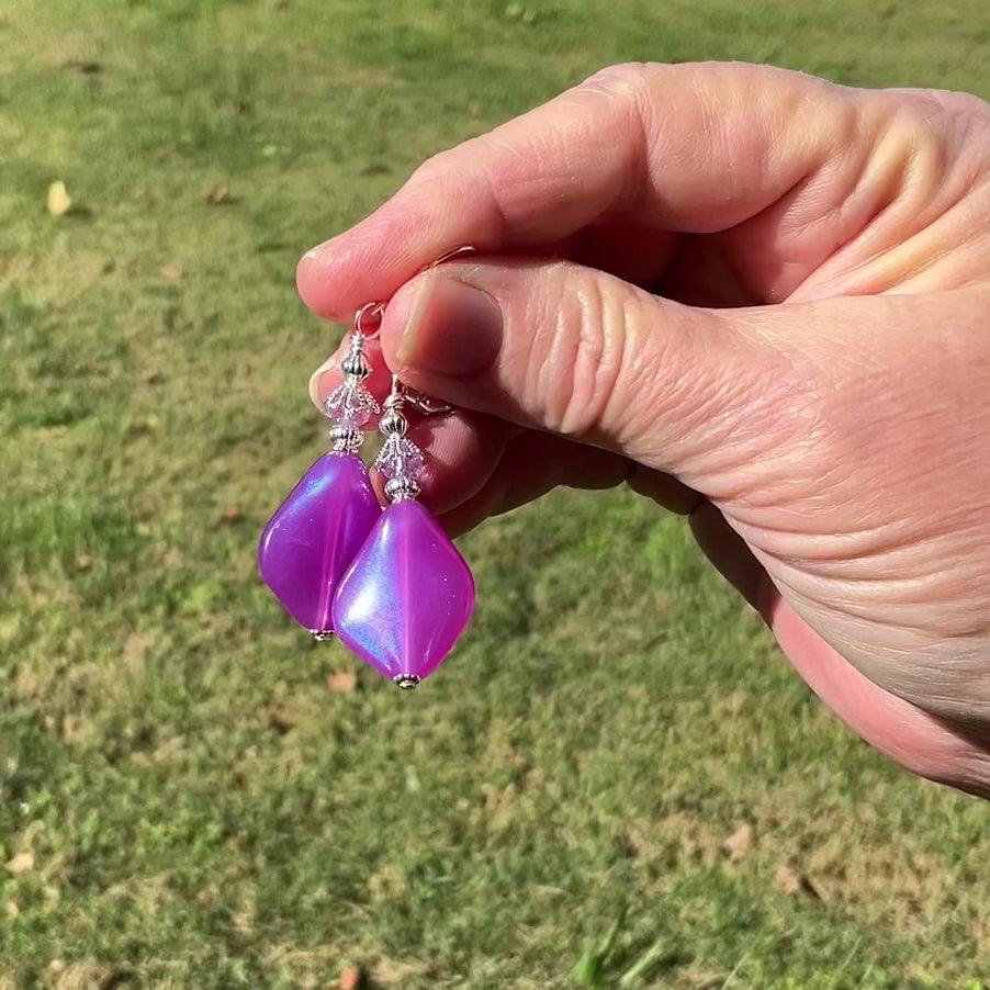 Handmade Color Shift Purple Lucite Earrings video showing how the color shifts as they move around in the light.