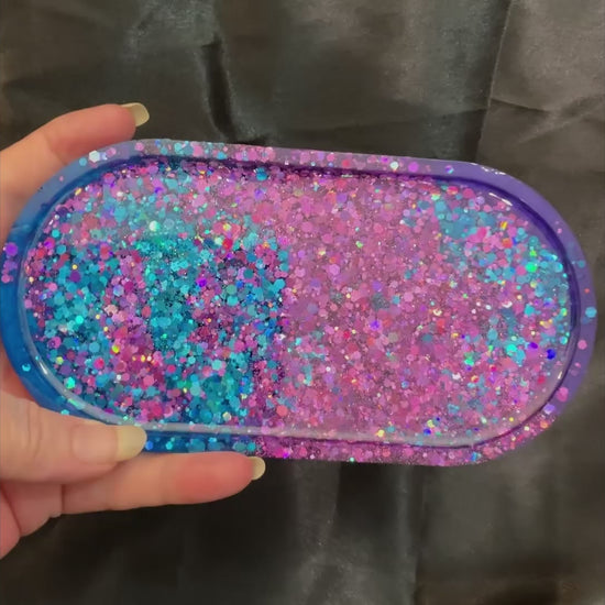 Video of the handmade resin trinket dish showing how the purple and blue glitter sparkles in the light.