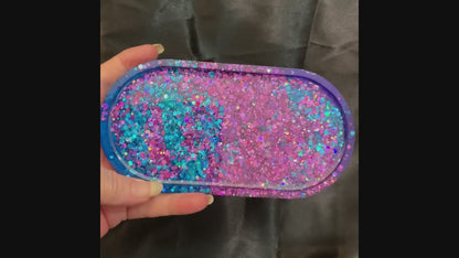 Video of the handmade resin trinket dish showing how the purple and blue glitter sparkles in the light.