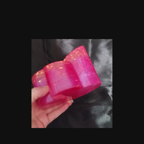 Handmade Bright Pink Resin Makeup Brush Holder with Iridescent Glitter video showing how the glitter sparkles in the light.