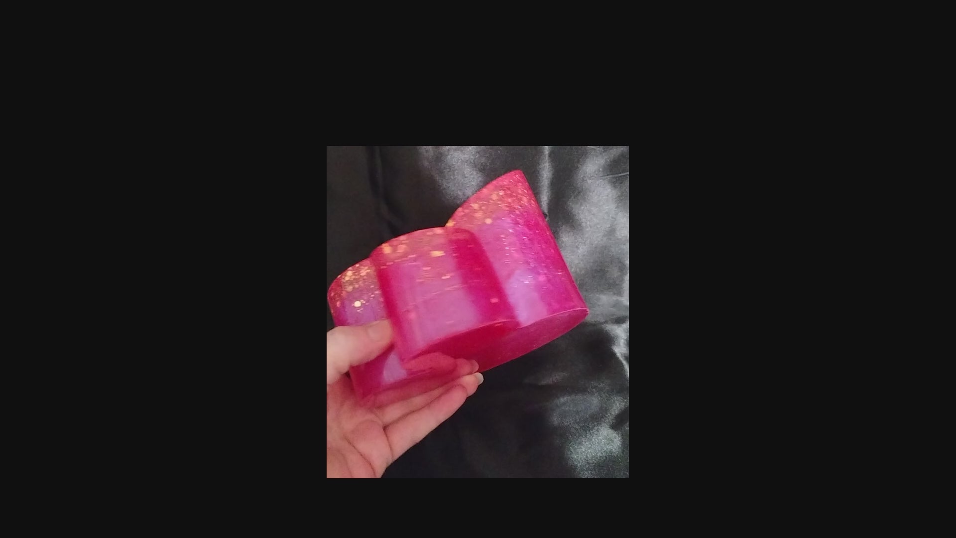 Handmade Bright Pink Resin Makeup Brush Holder with Iridescent Glitter video showing how the glitter sparkles in the light.