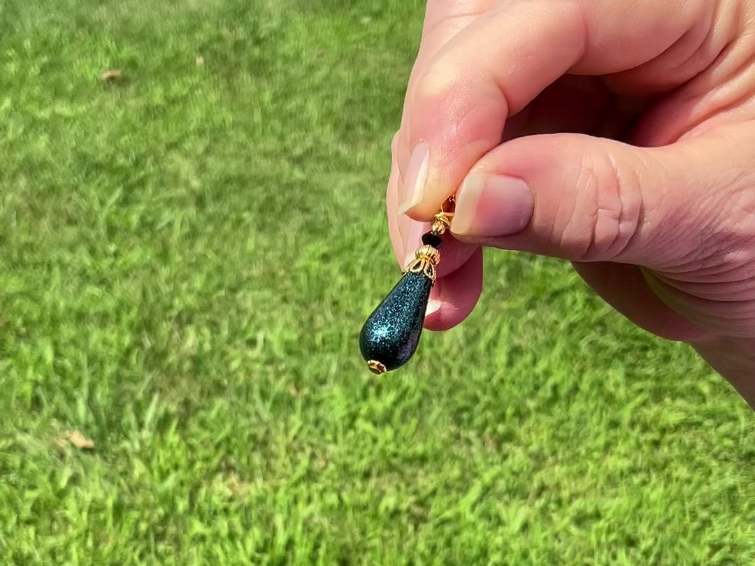 Dark Teal Glitter Handmade Teardrop Earrings video showing how the glitter sparkles in the sun.