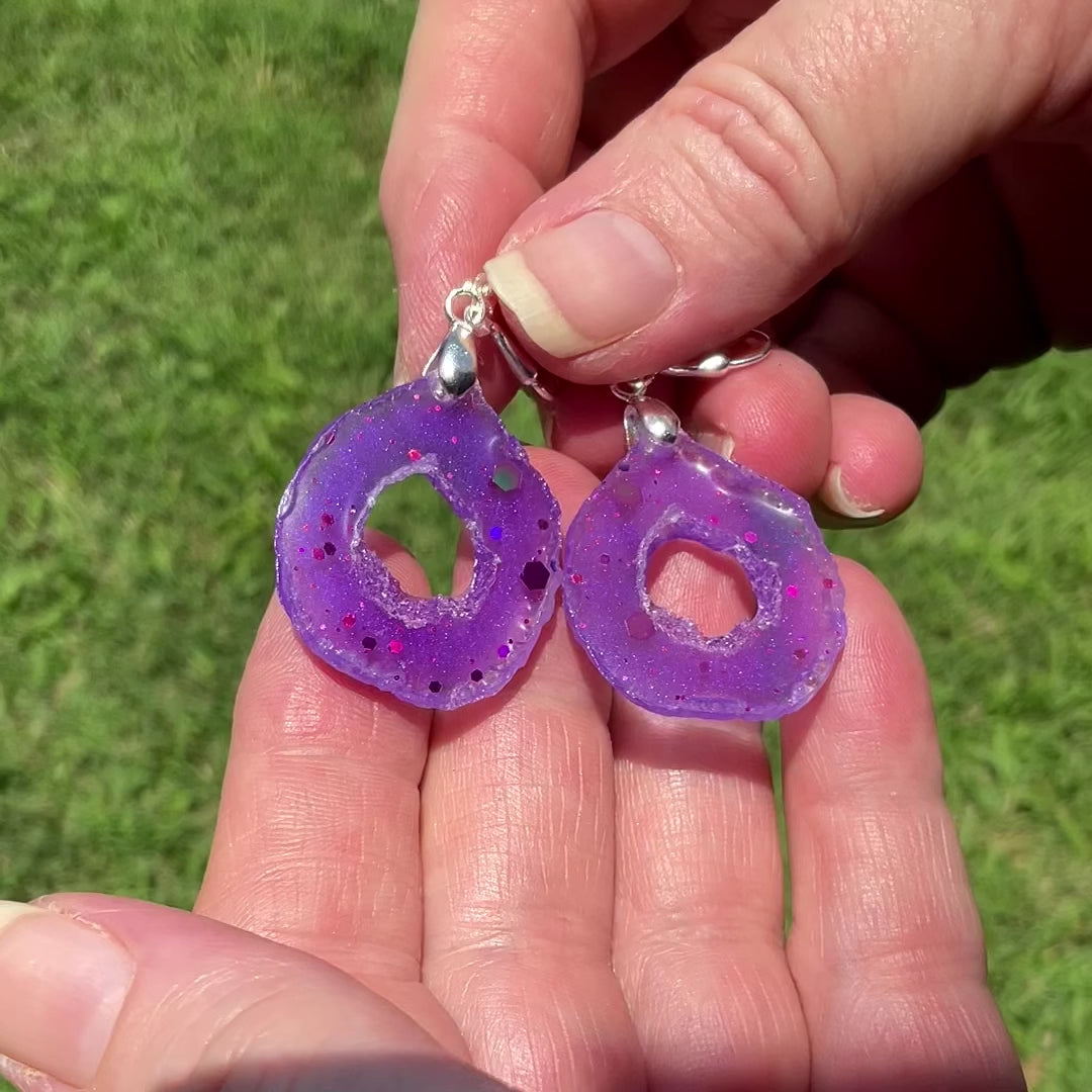 Purple with Glitter Resin Druzy Geode Slice Style Handmade Earrings video showing how the glitter sparkles as they move around in the light.