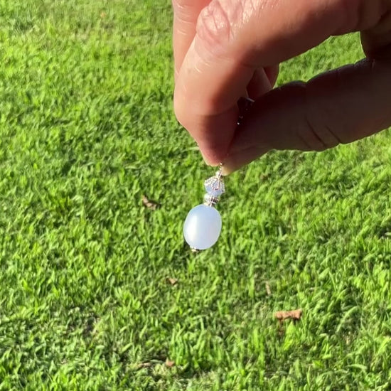 Silver Plated Periwinkle Blue Moonglow Lucite Drop Handmade Earrings video showing the glowy like effect on the moonglow beads in the light.