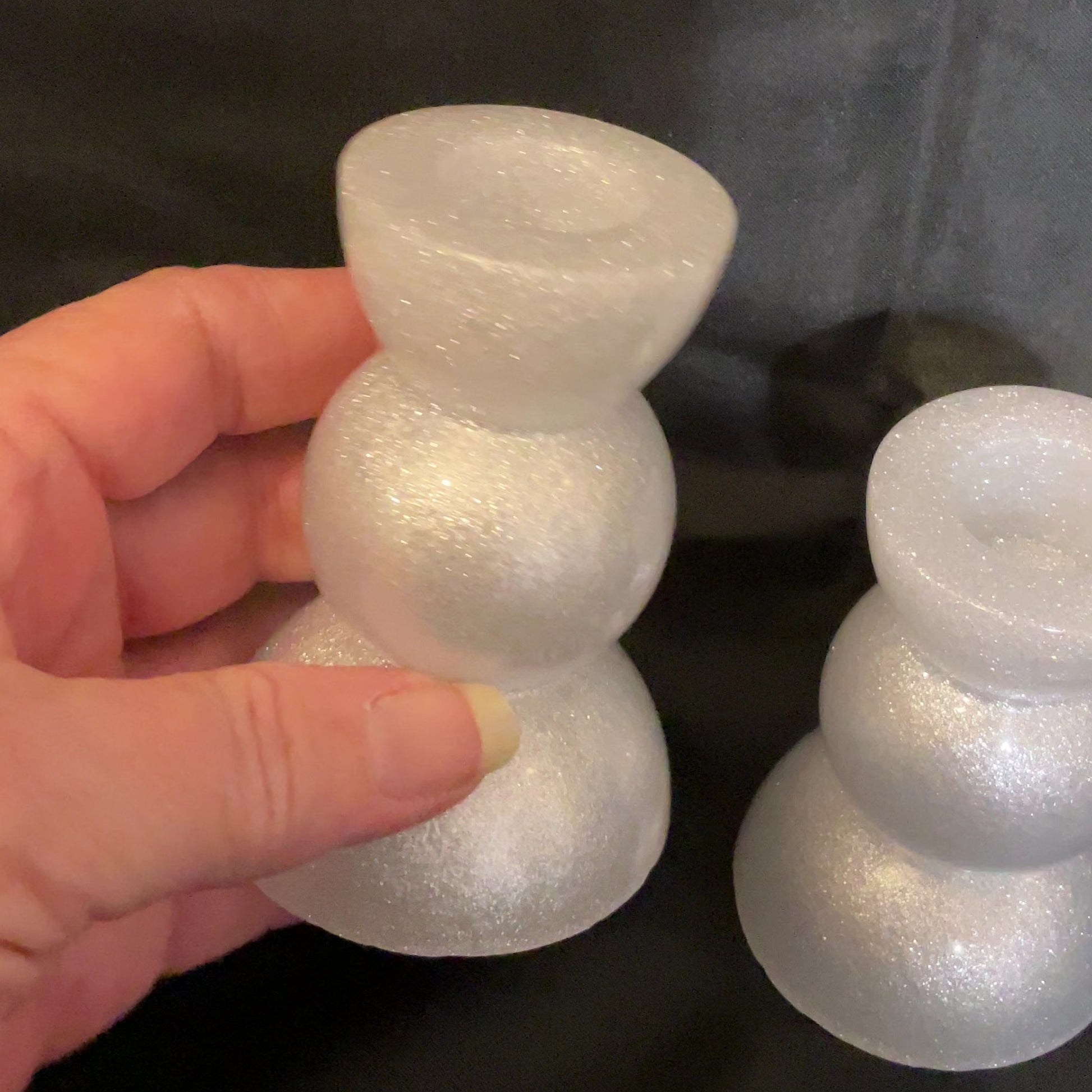Set of Two Sparkly White Resin Handmade Rounded Geometric Candlestick Holders video showing how they sparkle in the light.