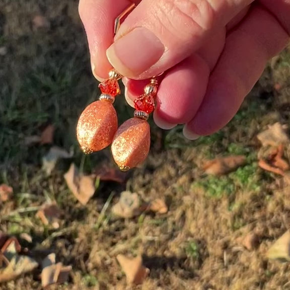 Handmade Drop Earrings with Orange Vintage Acrylic Glitter Beads video showing the gold plated version and how the glitter sparkles in the light.