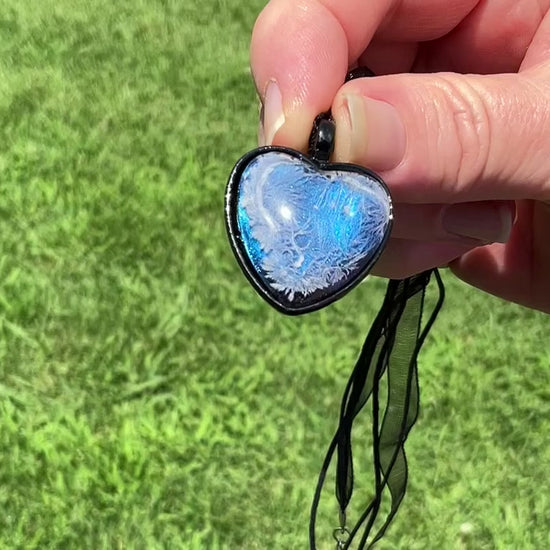  Iridescent Blue Frost Resin Handmade Cold Hearted Black Heart Pendant Necklace video showing how the iridescent blue shades shimmer and change in the light.