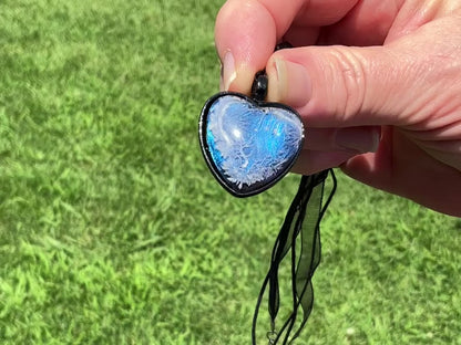  Iridescent Blue Frost Resin Handmade Cold Hearted Black Heart Pendant Necklace video showing how the iridescent blue shades shimmer and change in the light.