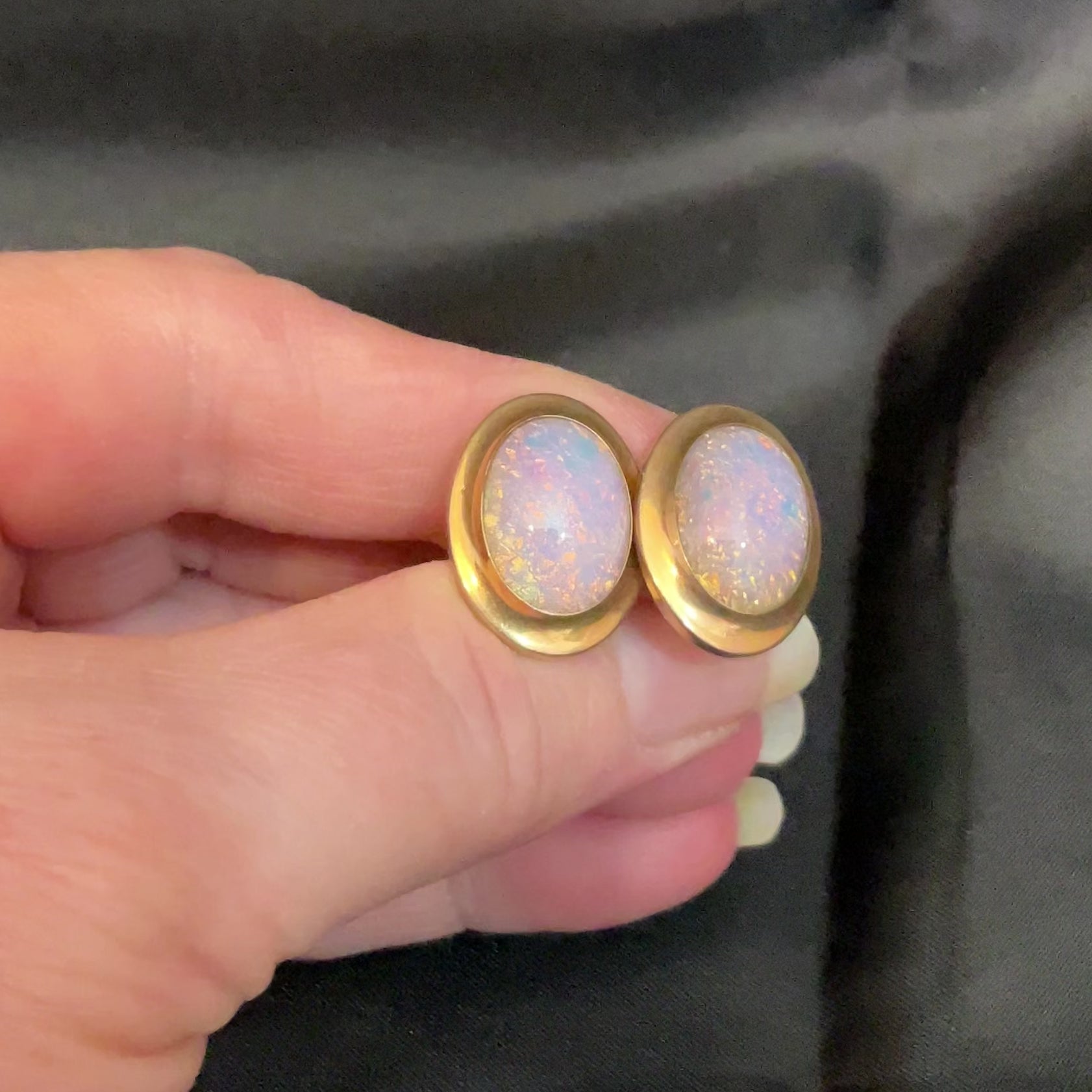 Video of the Correct Quality Mid Century vintage faux opal cufflinks showing the color flash in the light.