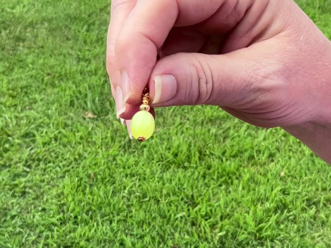 Gold Plated Small Yellow Moonglow Lucite Handmade Drop Earrings video showing how the lucite has a glow like effect in the light. 