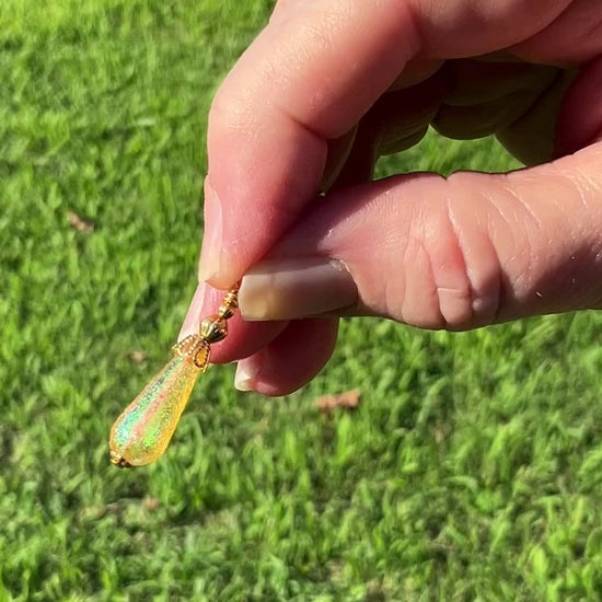 Gold Plated Small Handmade Yellow Glitter Lucite Teardrop Earrings video showing how the glitter sparkles in the light.