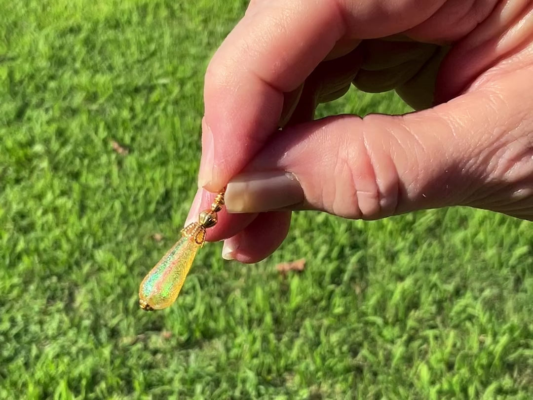 Gold Plated Small Handmade Yellow Glitter Lucite Teardrop Earrings video showing how the glitter sparkles in the light.