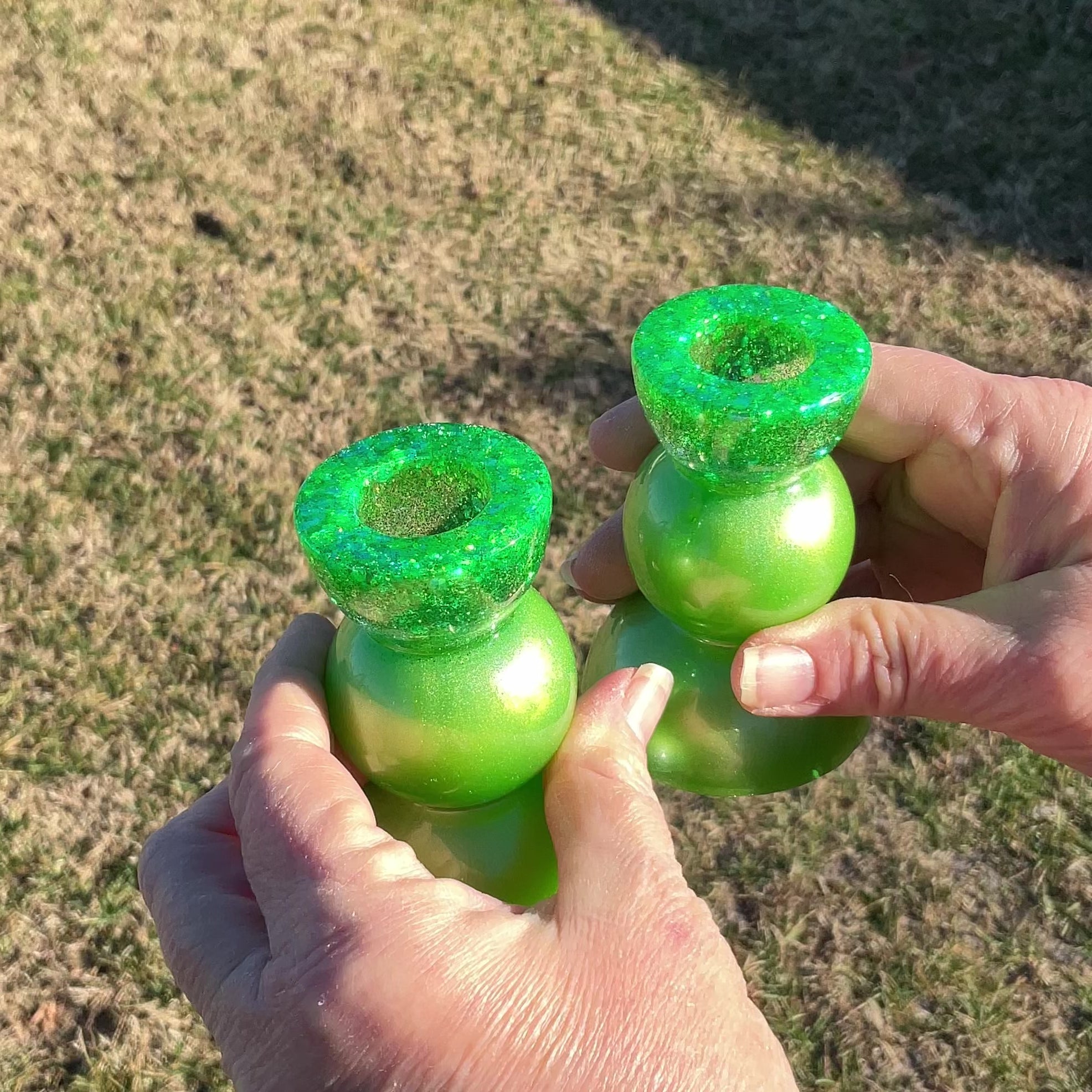 Two Handmade Pearly Lime Green Resin Rounded Geometric Candlestick Holders with Chunky Iridescent Glitter video showing how the glitter sparkles in the light.