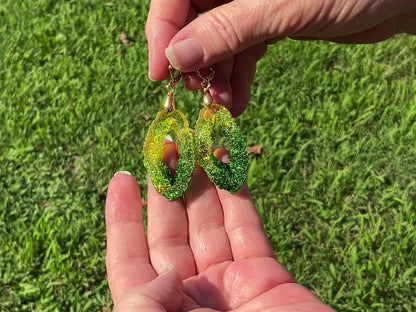 Faux Druzy Geode Slice Style Green and Yellow Resin Handmade Earrings video to show how the glitter sparkles as they move around in the light.