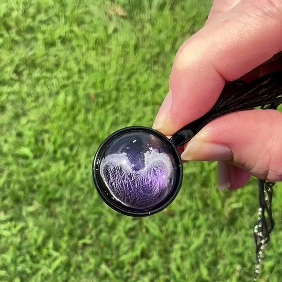 Handmade Black and Iridescent Purple Domed Round Frost Resin Pendant Necklace video showing how the iridescent purple shimmers in the light.
